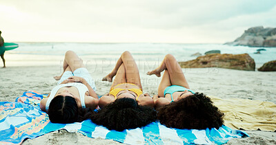 Buy stock photo Ocean, women and friends relax on blanket for holiday, vacation or travel together on tropical island. Outdoor, girls and group lying at beach for rest, sunbath or tan in summer at sea in nature