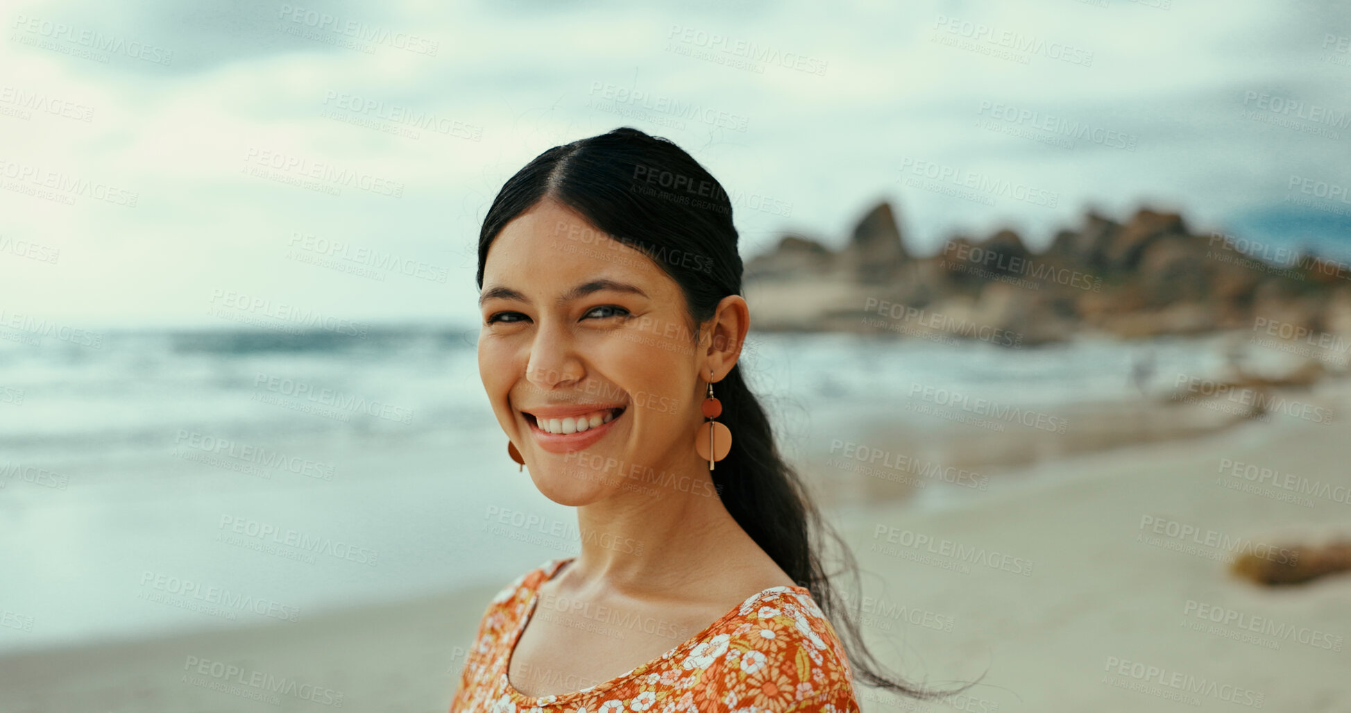 Buy stock photo Portrait, relax and happy woman at sea for holiday, vacation and travel outdoor for adventure. Beach, smile and female person in nature at ocean for trip, summer and tourist on island in Portugal