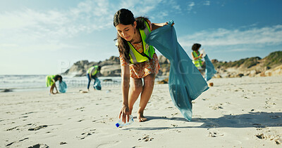 Buy stock photo Woman, volunteer and cleaning beach with bag for recycling, eco friendly environment or earth day. Female person, activist or community service with pollution or dirt for charity or climate change