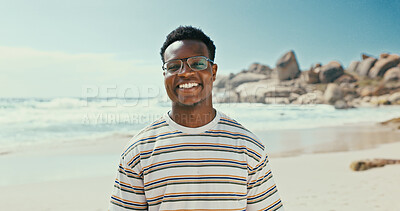 Buy stock photo Portrait, smile and black man at sea for vacation, holiday and travel outdoor for adventure. Ocean, tourism and happy person with glasses in nature at beach for trip, summer and relax in Zanzibar