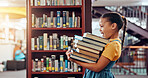 Happy, carry and girl with books in library excited for reading story, literature and learning. School, bookstore and child with stack of novels for knowledge, education and language development