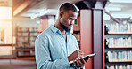 Education, college and man with tablet in library for knowledge, reading or study. African student, digital technology and research in university with pen for thesis, writing notes or learning online