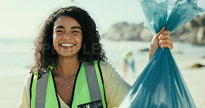 Buy stock photo Happy woman, portrait and volunteer with recycling on beach for eco friendly environment or cleaning. Female person, activist or community service with smile, bag or dirt for earth day or save planet