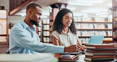 Buy stock photo University, studying and students in library on laptop for online research, information and help for project. College, academy and man and woman with books for education, knowledge and learning