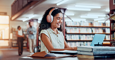 Buy stock photo Woman, headphones and laptop in library for university, student and studying for education or project. Happy person, notes and academy campus with online video, research and assignment for knowledge