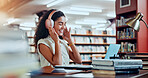 Woman, headphones and smile in library for university, student and studying for education or project. Happy person, music and academy campus with online video, research and assignment for knowledge