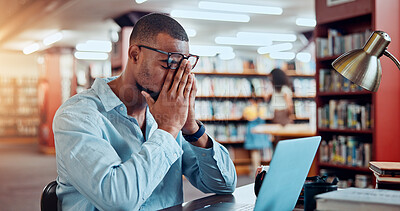 Buy stock photo Black man, laptop and pain in library for education, research or project deadline for university student. African person, stress and headache with eye strain on campus for overtime or burnout
