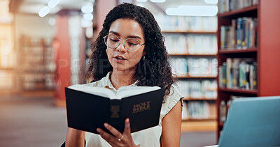 Buy stock photo Woman, bible study and reading at library for learning for theology assessment at university. Girl, college student and research with religion, history and book for project, scholarship or education
