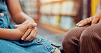 Hands, woman and girl with care, comfort and emotional support with trauma counselling. Closeup, kid and counsellor with child development, trust and reaction with anxiety, security and safety