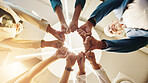 Below, fist bump and hands of business people in office for teamwork, collaboration and solidarity. Professional workers, corporate and men and women in circle for celebration, support or partnership
