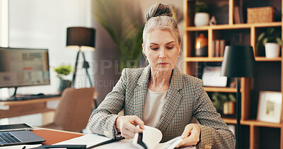 Buy stock photo Accounting, paperwork and mature business woman with budget, bookkeeping and reading finance report. Auditor, check document and serious manager in office for revenue, income or payroll information