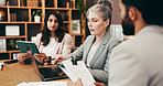 Discussion, laptop and business people in office with creative project in collaboration for publishing. Meeting, computer and group of editors with manager for feedback, review or advice in workplace