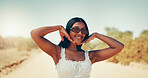 Woman, travel and outdoor with confidence for fashion, happy and hand frame in nature. Girl, portrait and summer style in desert for tourism vacation, sunglasses and smile in Puerto Rico countryside