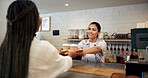 Cafe, customer and woman with coffee, serving and smile for purchase in store, giving and hospitality. Small business, waitress and person with latte for consumer, happy and checkout for takeaway