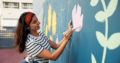 Buy stock photo Painting, happy and woman with wall for mural art design, creative project and community service. Artist, volunteer and person with paintbrush for flower decor, inspiration and DIY hobby in city