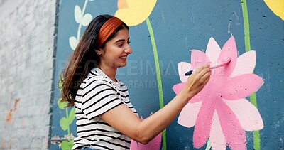 Buy stock photo Painting, mural and woman in city with flowers for art design, creative project and community service. Artist, happy and person with paintbrush outdoor for wall decor, inspiration and DIY hobby