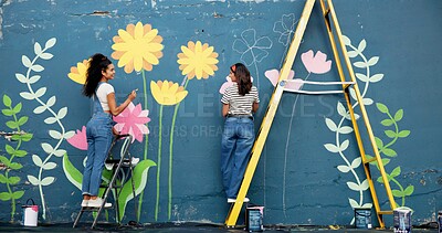 Buy stock photo Wall, mural painting and women with ladder, community project and artist with cooperation. Volunteer, outdoor and friends with creativity, expression and diy decor with flowers, student and hobby