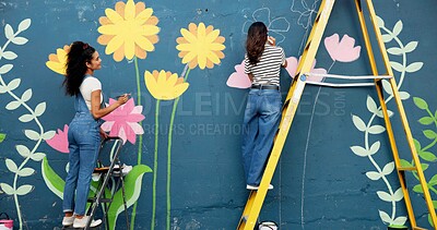 Buy stock photo Back, women and painting mural for wall, ladder and community project with cooperation. People, outdoor and friends with creativity, expression and diy decor with flowers, student hobby and art