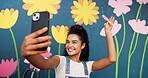Selfie, artist and wall with woman in city for flower mural, earth day promotion and eco painting. Sustainability awareness, environment activist and photography with person and biodegradable painter