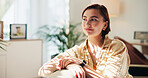Woman, smile and thinking in home, living room and reflection with memory, relax and nostalgia. Person, happy and mindset with daydream, inspiration and perspective on sofa in lounge at apartment