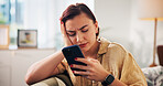 Woman, phone and sad on sofa in home for breakup, notification and bad news in living room. Person, smartphone and depressed with stress on mobile app, mental health or social media on couch at house