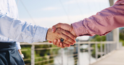Buy stock photo Business people, meeting or handshake with partnership on bridge for teamwork, b2b or agreement in city. Closeup, employees or colleagues shaking hands with greeting for introduction in an urban town