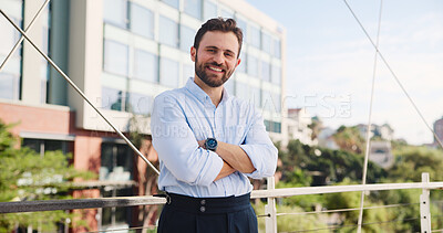 Buy stock photo Portrait, confidence and happy businessman in city for travel, ambition and urban planner with pride. Smile, arms crossed and professional employee outdoor on bridge with town developer in Germany