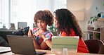 Women, laptop and photographer with camera for small business, content creation or production at home. Female people, freelancers or remote workers with technology or app for online startup or media