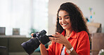 Happy woman, photographer and small business with camera for editing, retouch or online content creation. Female person, freelancer or remote worker with smile, technology or lens for production