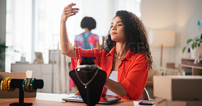 Buy stock photo Small business, entrepreneur and woman with jewellery, checking and quality control for design in shop. Startup, retail and person with necklace, merchandising and thoughtful for price of product