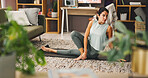 Woman, yoga and exercise with mat for pilates, workout or mindfulness on living room floor at home. Female person, yogi or body warm up with spinal twist pose for fitness, zen or balance at house