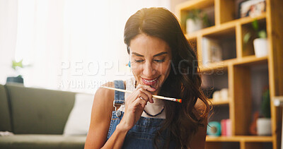 Buy stock photo Thinking, woman and painter in home for art, creative inspiration and insight for design. Brush, smile and artist with ideas for drawing, reflection and vision for hobby with thoughts in living room