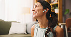 Happy, woman and earphones for listening with fitness break in home, music or podcast for exercise motivation. Wellness, workout and female person with wireless audio tech, radio or relax in house