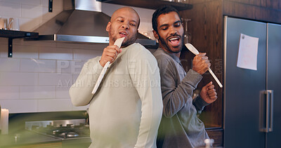 Buy stock photo Gay couple, singing and men in kitchen, fun or bonding with music in house, karaoke or relationship. Home, romance and people with wooden spoon for song, lgbtq or happy for entertainment in apartment