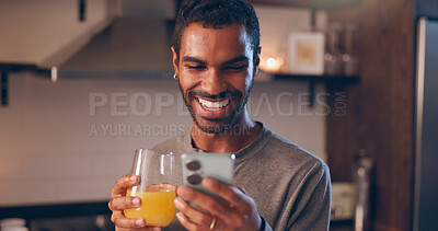 Buy stock photo Man, phone and juice in home with social media, favorite beverage and happy for vitamin C benefits. Person, mobile and smile with orange drink for text, contact and research health tips in kitchen