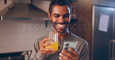 Buy stock photo Man, mobile and juice in home with social media, favorite beverage and happy for vitamin C benefits. Person, phone and smile with orange drink for text, contact and research health tips in kitchen