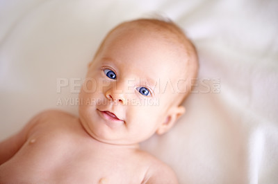 Buy stock photo Baby, newborn and portrait from above with comfort, security and care, hygiene or relax at home. Face of newborn girl or child wide eyes for curious expression, hearing or listening to sound on bed