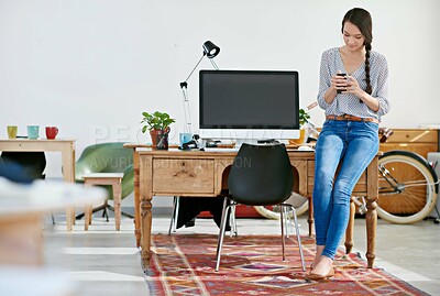 Buy stock photo Woman, office and texting with smartphone for research, online trends and ideas for magazine photoshoot. Employee, female person and serious in creative business on internet, social media and website