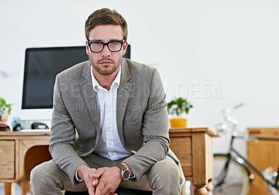 Buy stock photo Portrait, business and man serious in office as web designer for ambition, research and creative media for agency development. Pensive, male person and developer with glasses, formal and startup
