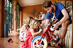 Teaching her how to fix a bicycle