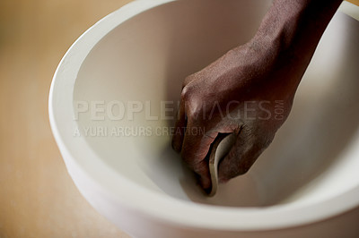 Buy stock photo Pottery, hand and person sanding in workshop for art, creative craft and design for production process. Ceramic, artist and closeup of potter with tools, sandpaper and polish bowl for smooth texture