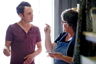 Buy stock photo Business people, discussion and ceramic workshop with planning, smartphone and conversation with social media. Employees, entrepreneur and cooperation with cellphone,  teamwork and artistic design