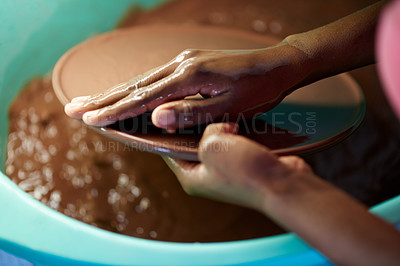 Buy stock photo Pottery, hands and person in workshop with water, dust removal and clay hydration for sculpting. Ceramic production, artist and mud in studio for washing, creativity and design process with piece