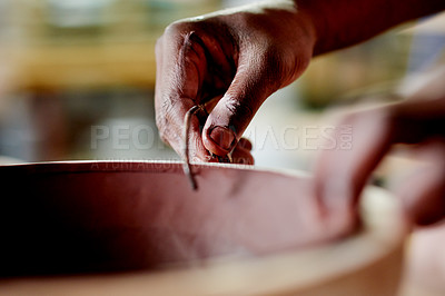 Buy stock photo Potter, clay and hands with tool in workshop for sculpture trim, design process and ceramics shaping. Small business, pottery and person with handmade bowl for handicraft, production or manufacturing