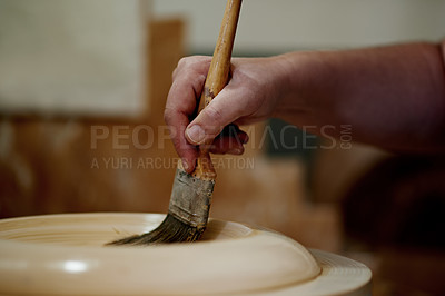 Buy stock photo Hands, clay and pottery with paintbrush at workshop for ceramic manufacturing, craft and process for sculpture. Person, art and equipment with shape, patterns and results with creativity at studio