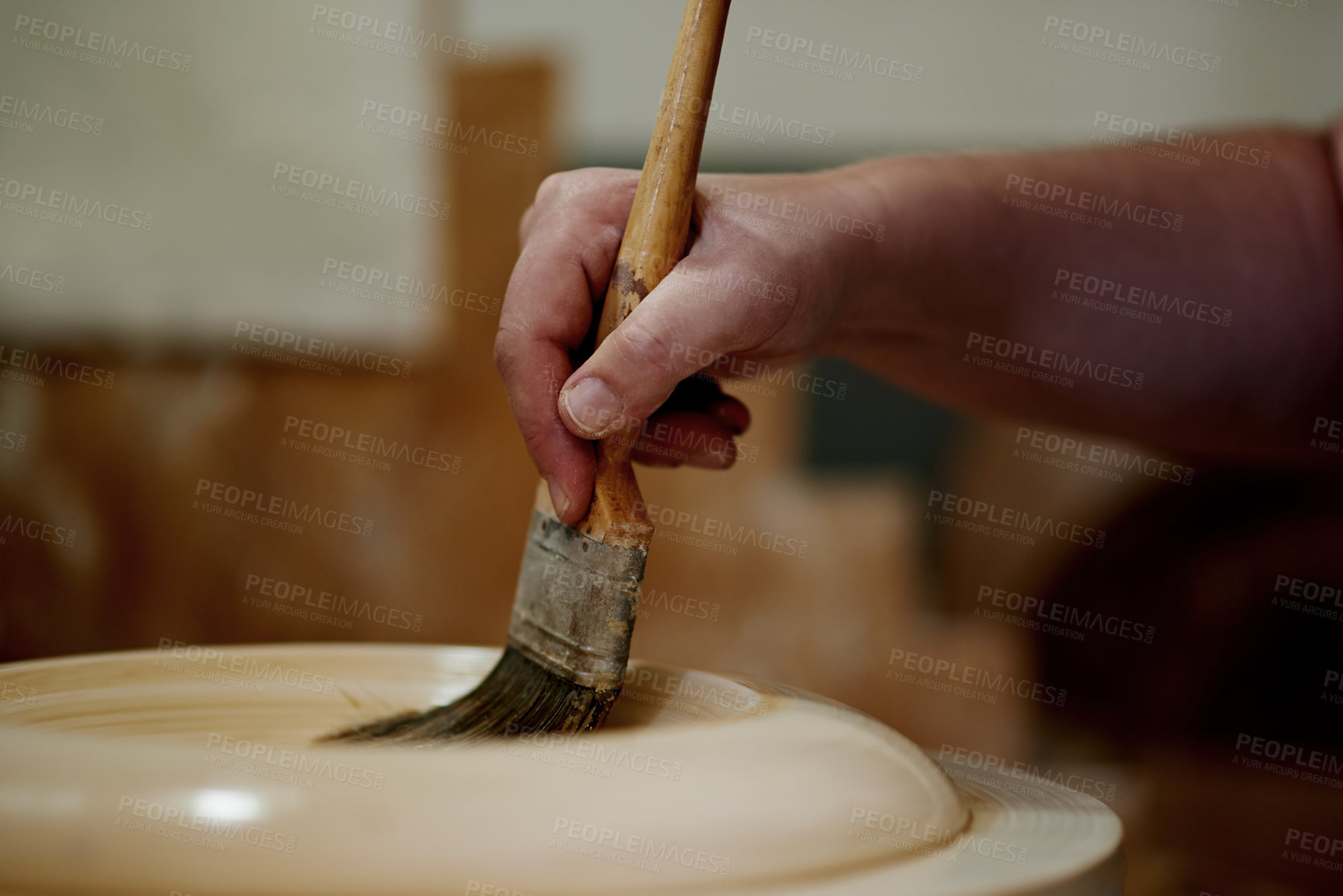 Buy stock photo Hands, clay and pottery with paintbrush at workshop for ceramic manufacturing, craft and process for sculpture. Person, art and equipment with shape, patterns and results with creativity at studio
