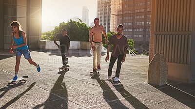 Buy stock photo Training, city and group with skateboard, skating and practice for competition on road, edgy and outdoor. Fitness, together and people with equipment for game, urban and athlete with hobby on street