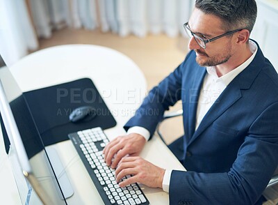Businessman or financial advisor and work with computer on email for planning a proposal above. Serious, worker and reading review or analyzing with technology for insight on report or review