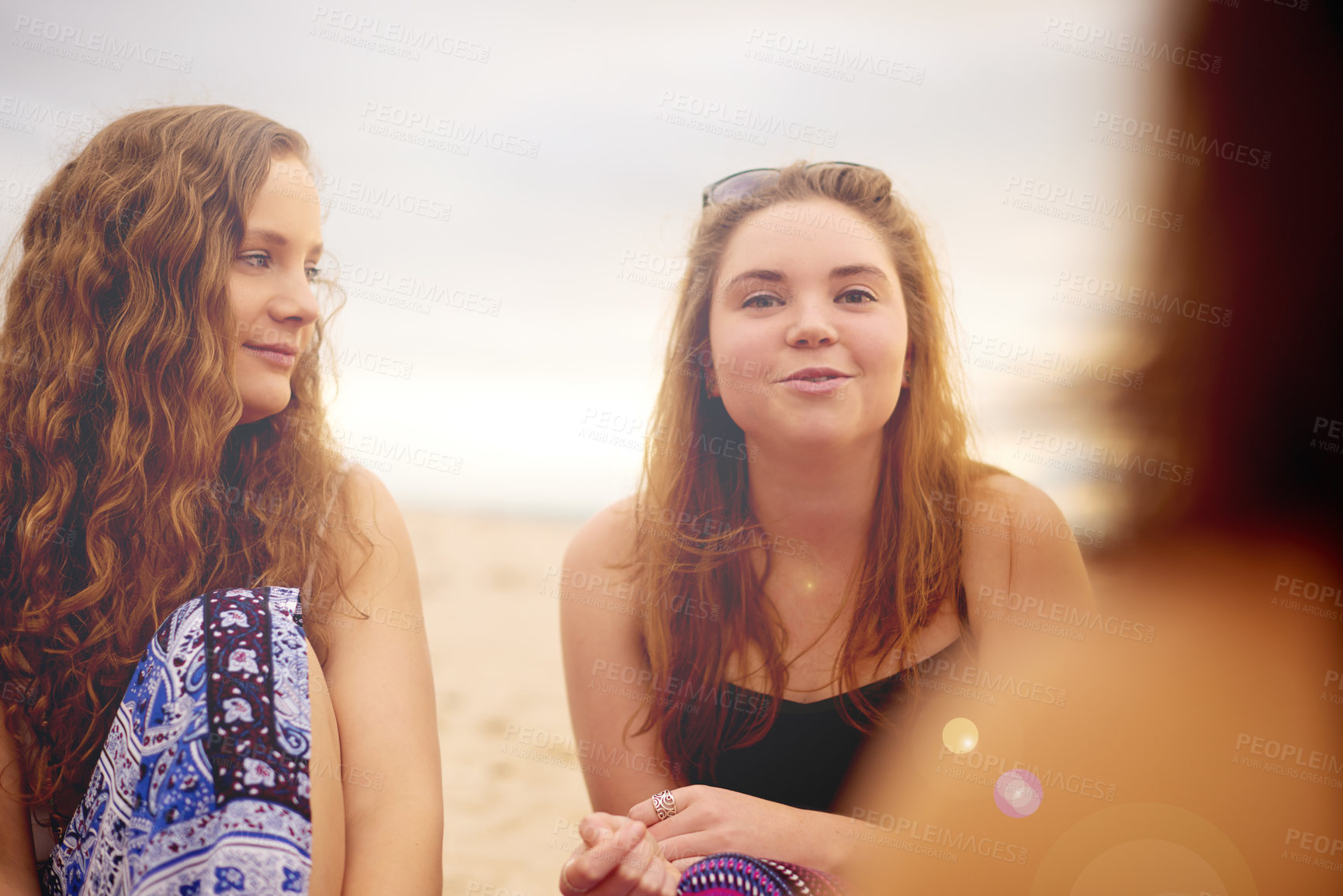 Buy stock photo Beach, friends and relax in portrait for conversation, holiday and bonding together with talking. Ocean, girls and teenager with communication for travel, vacation and peaceful with people outdoor