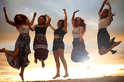 Buy stock photo Portrait, beach and jumping with women, vacation and sunset with energy, smile and tropical island. Ocean, people and friends with summer holiday, break or journey with celebration, travel or reunion